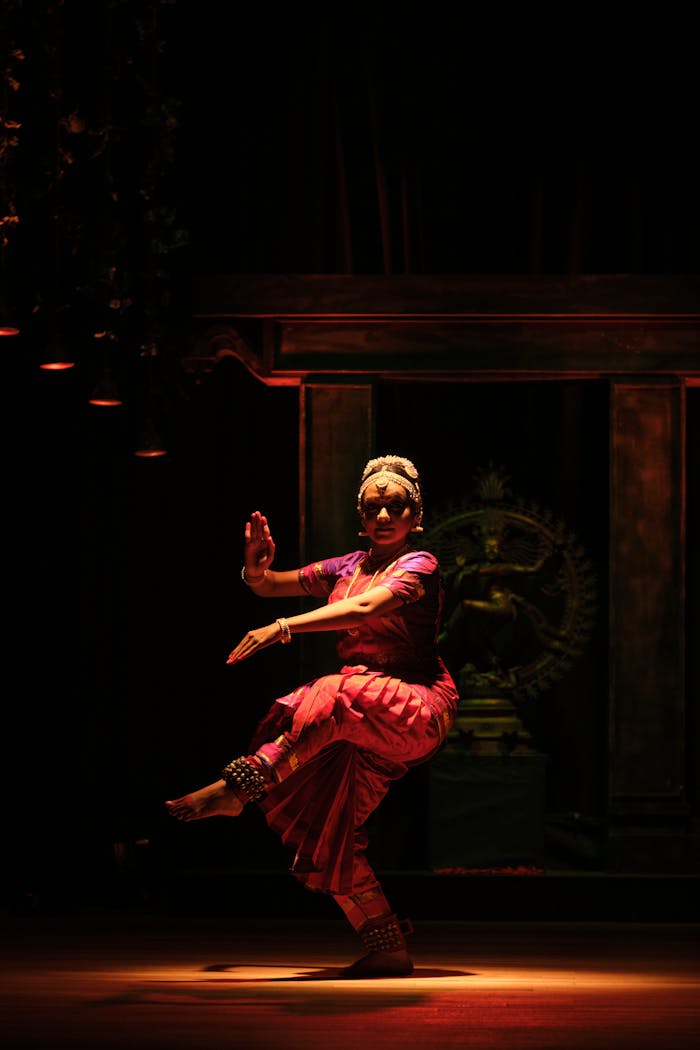 Dancer in Traditional Clothing Dancing in Darkness at Temple